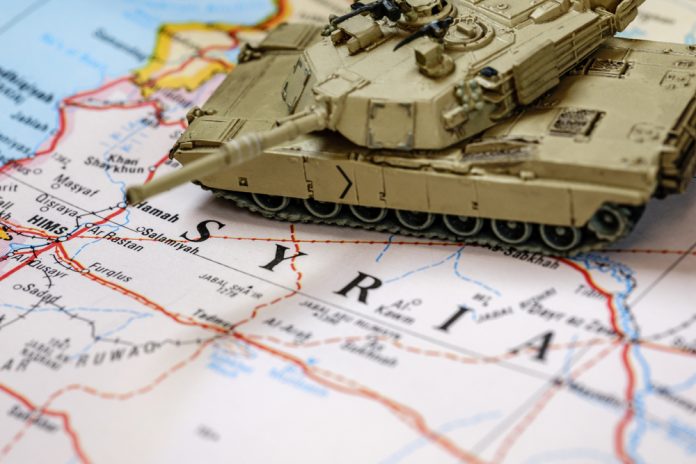 In,Focus,M1,Abrams,Armored,Tank,On,Top,Of,Blurry