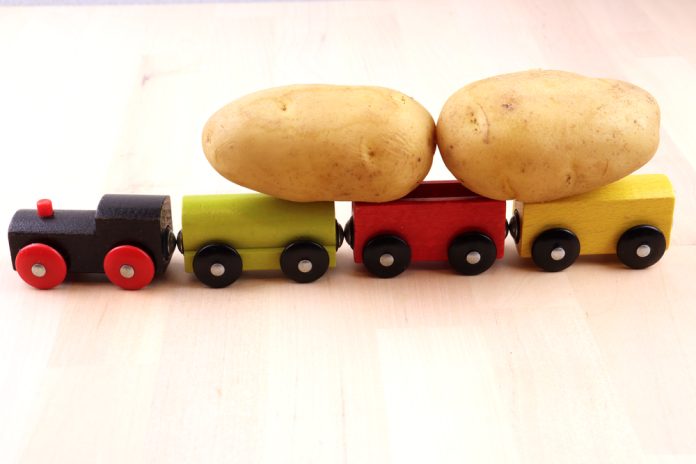 A,Toy,,Wooden,,Multi-colored,Train,Transports,A,Crop,Of,Young