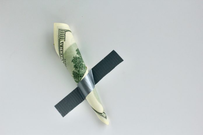 Money,Duct,Taped,To,The,Wall.conceptual,Photo.,Background,For,Sticker,
