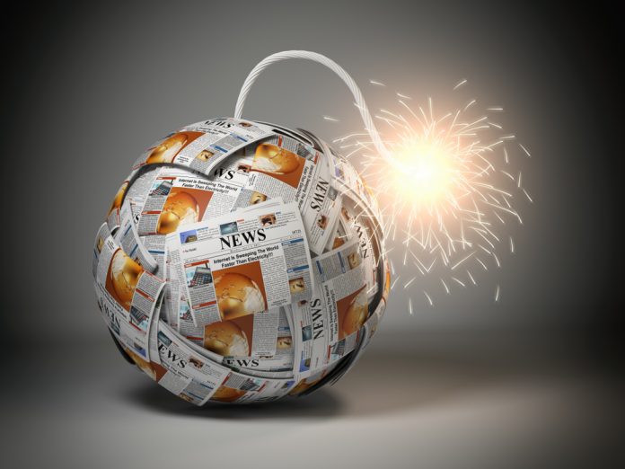 Breaking,Hot,News,Concept.,Bomb,From,Newspapers,With,Wick,And