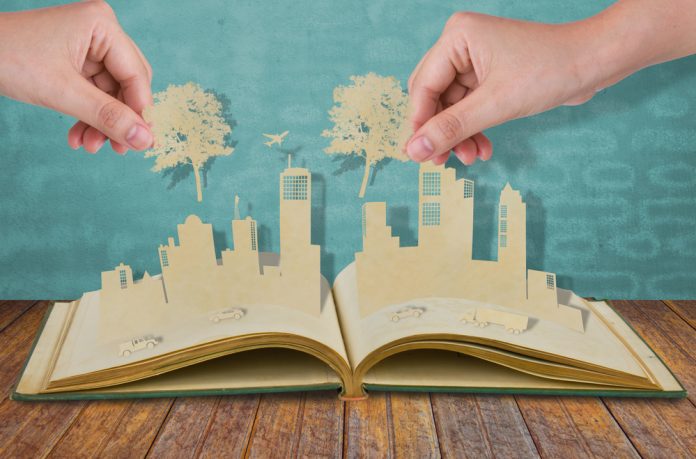 Hand,Hold,Paper,Cut,Of,Tree,Over,Paper,Cut,Of