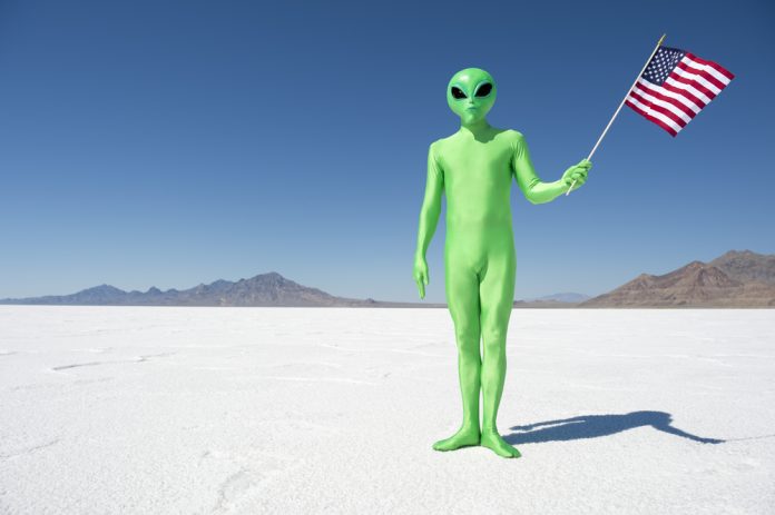 Legal,(or,Illegal),Alien,Making,A,Patriotic,Immigration,Statement,Holding