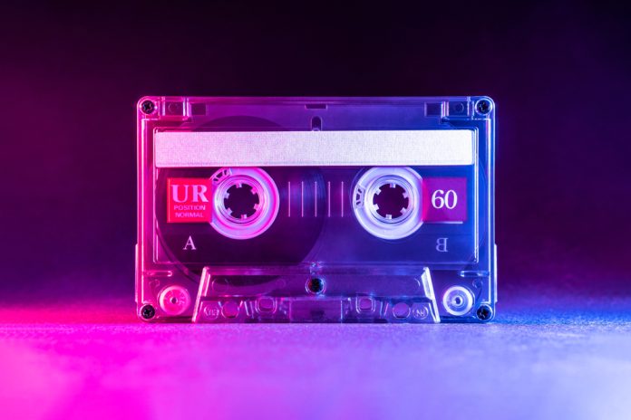 Transparent,Audio,Cassette,Tape,Lit,By,Pink,And,Blue,Lamps