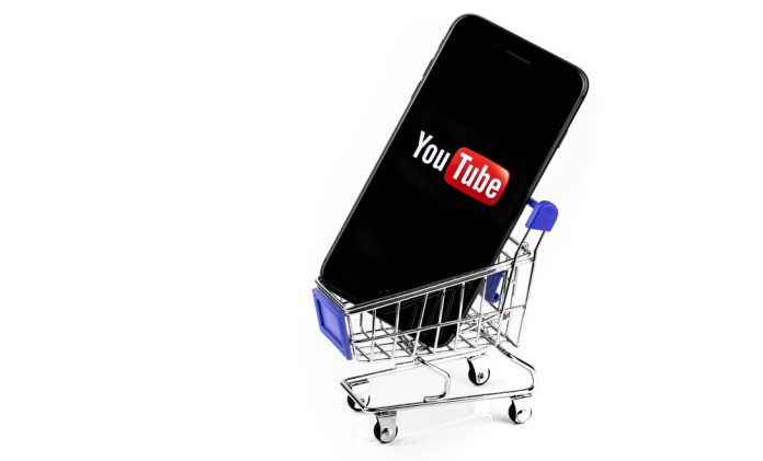 Shopping,Cart,With,Smartphone,With,Youtube,Logo,On,The,Screen
