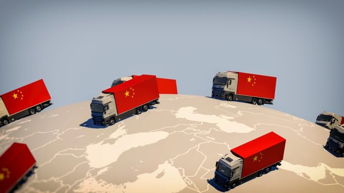 Many,Trucks,With,The,Chinese,Flag,Drive,Around,On,A