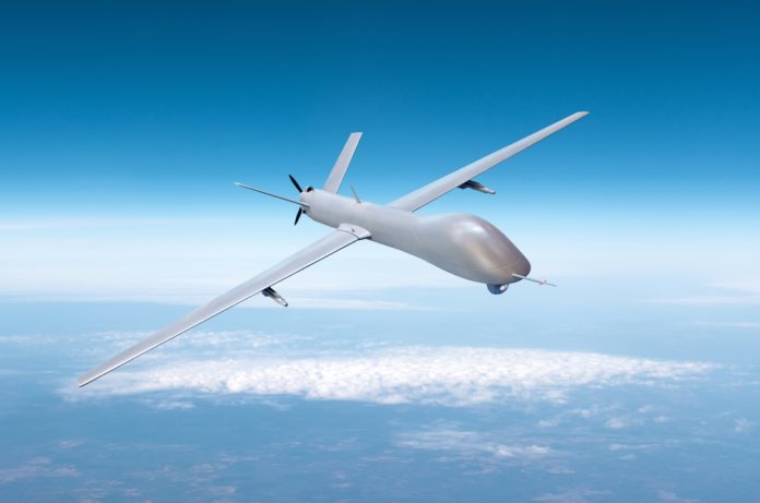 Unmanned,Military,Drone,On,Patrol,Air,Territory,At,High,Altitude Savaşın ve barışın “insansız” hali: İHA’larla nasıl bir gelecek bizi bekliyor?